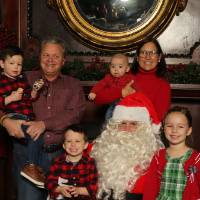 Family of six with Santa Claus
